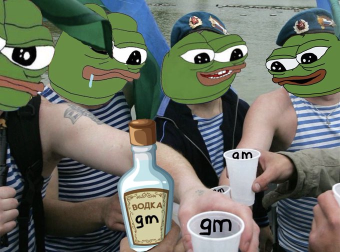 A humorous edited photo showing people in striped tank tops with Pepe the Frog faces edited over their heads, wearing military-style berets, toasting with plastic cups labeled "am" and "gm" around a bottle labeled "ВОДКА gm".