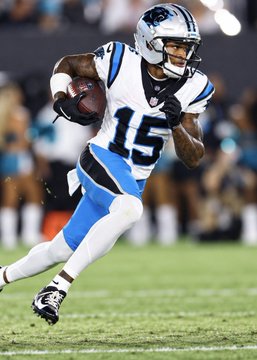 Carolina Panthers football player wearing jersey number 15 runs with the ball during a game.