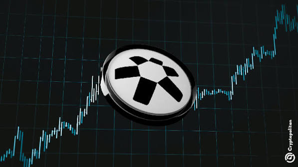 A stylized graphic features a black-and-white mining/pickaxe symbol coin floating over a rising stock chart on a dark grid background, with "Cryptopolitan" watermark in the corner.