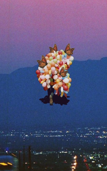 A surreal, dreamlike image shows a person walking while carrying a massive cluster of colorful balloons, with monarch butterflies perched on them, set against a purple twilight sky over a city landscape.