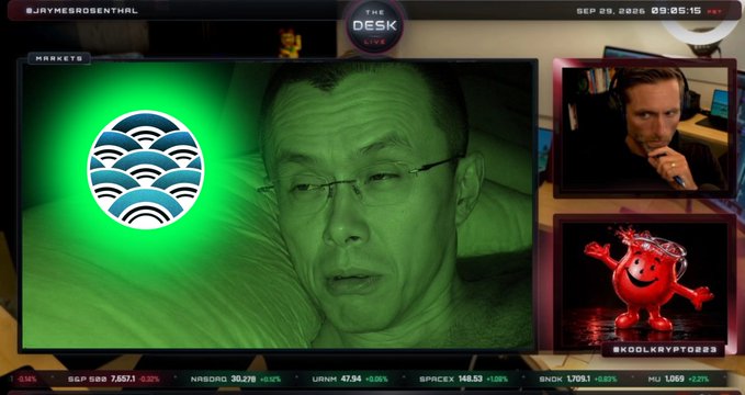 A financial livestream titled 'THE DESK LIVE' dated September 29, 2026, featuring a man speaking on the main screen with stock tickers (S&P 500, NASDAQ, URTH, SPACX, $NDX, MU) and two side panels showing a commentator and a Kool-Aid Man image.