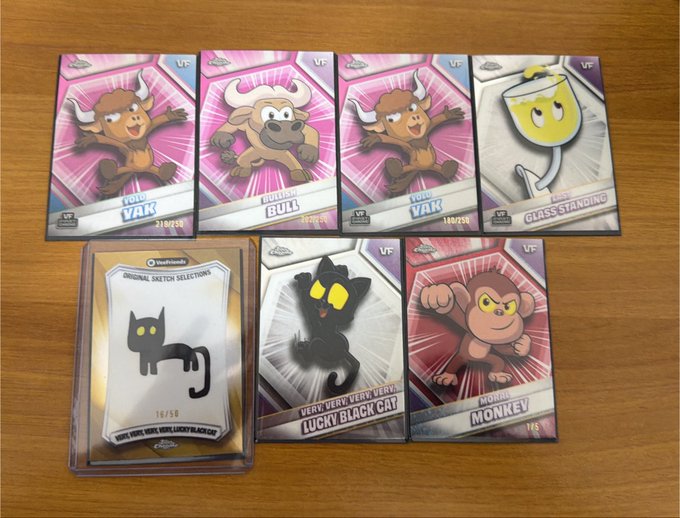 The image shows a collection of Veefriends collectible cards laid out on a wooden surface, including multiple "POYO VAK" cards (33/50, 31/50, 18/25), a "BULL" card (29/25), a "GLASS STANDING" card, an "ORIGINAL SKETCH SELECTIONS" card (#18/50), "VERY VERY VERY VERY LUCKY BLACK CAT," and a "MONKEY" card—all displayed to showcase the impressive pulls from opening 10 Value Boxes and 5 Mega Boxes of Veefriends trading cards.