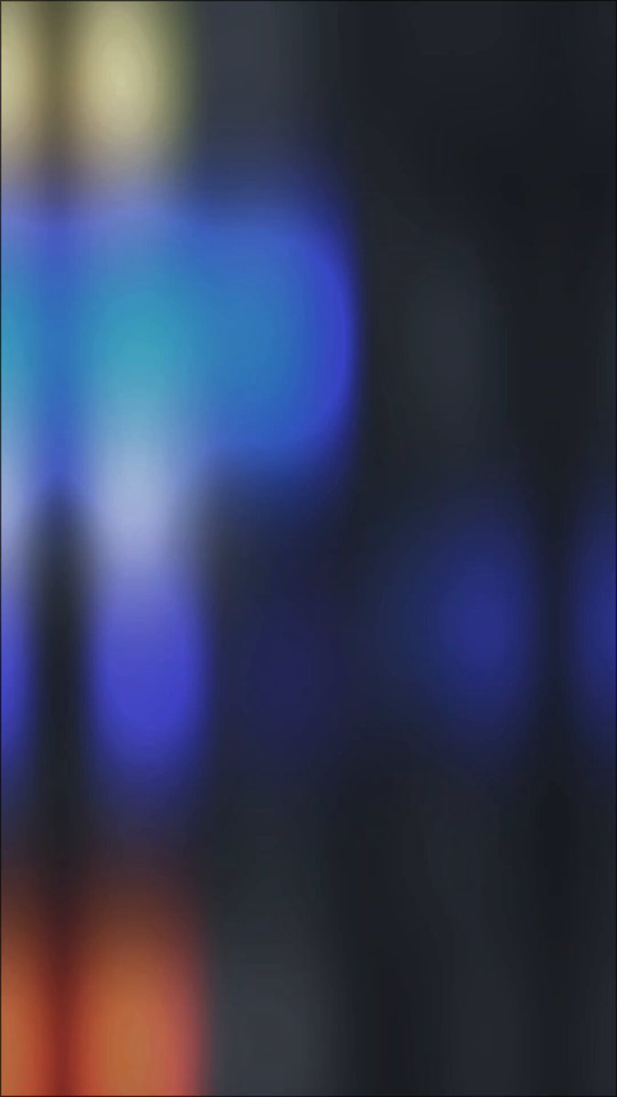 The image features a square background that appears blurry due to the low-quality camera used to capture it. The background consists of various colors including blue, orange, and green, creating an abstract and visually interesting scene. The caption below the image reads "GM gPoly Have you ever taken a look at my Polymarket profile? Most of the time, you'll see a Green PNL there :D". This implies that the person who posted this image might have been using their Polymarket account to share their experiences and insights with others.