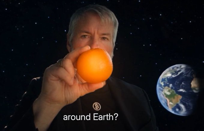 A man holds an orange up to the camera with Earth visible behind him, captioned "around Earth?"