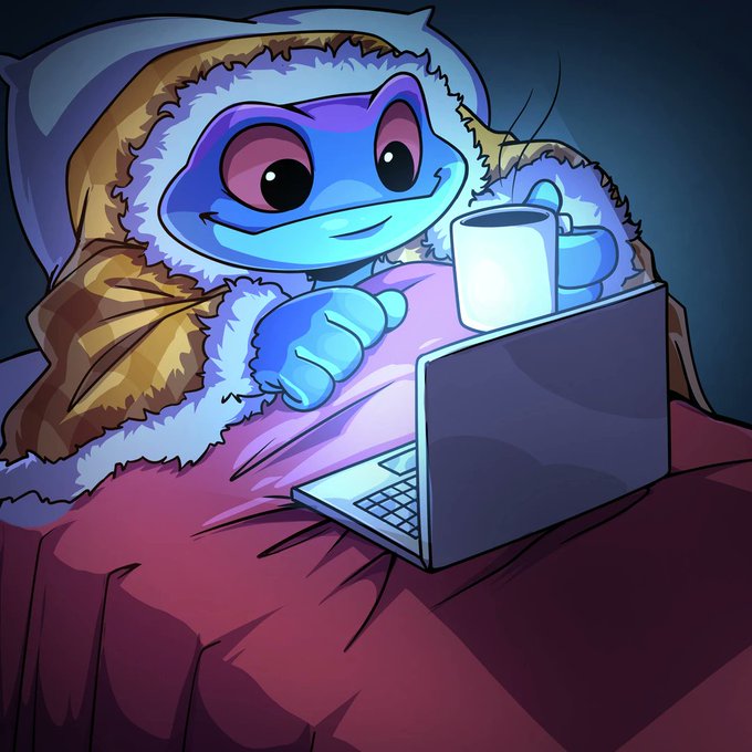 An illustration of a blue frog-like character wearing a furry hooded coat, sitting in bed with a laptop and holding a steaming mug.