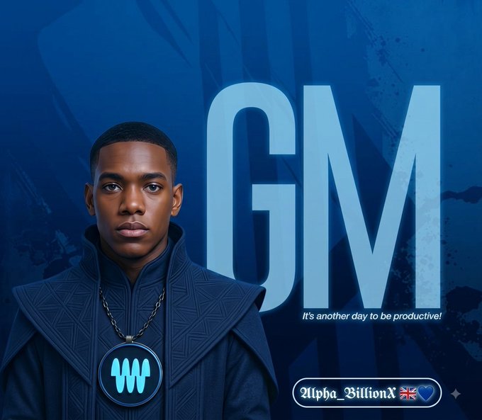 A digital portrait of a young Black man in an ornate blue garment with a glowing medallion, set against a blue background with large 'GM' text and the caption 'It's another day to be productive!', alongside a watermark 'Alpha_BillionX'.