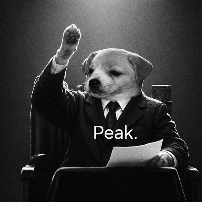 A black-and-white meme image of a dog in a suit with its fist raised, captioned 'Peak.'