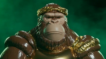 Close-up of a glossy gorilla figurine wearing gold laurel wreath headwear and gold chain necklaces against a dark green background.