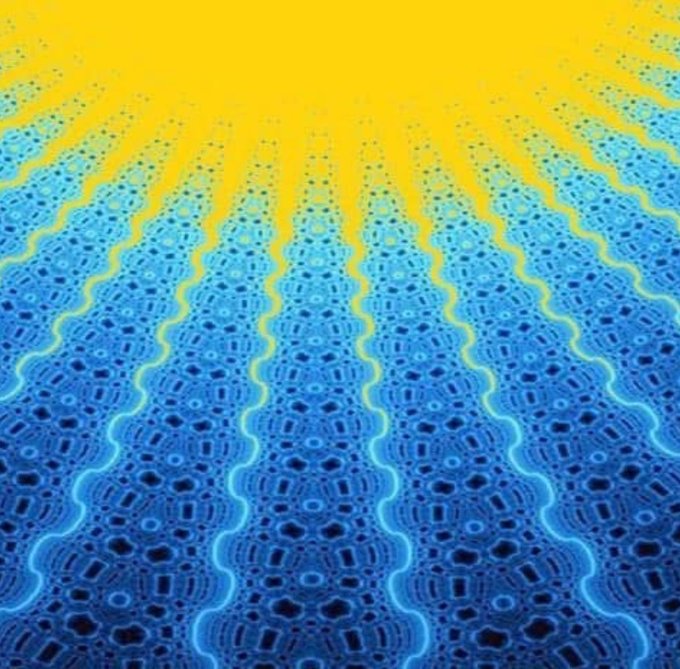An abstract digital artwork featuring a vibrant yellow-orange gradient at the top transitioning into wavy, textured blue patterns with intricate dot and ripple designs.