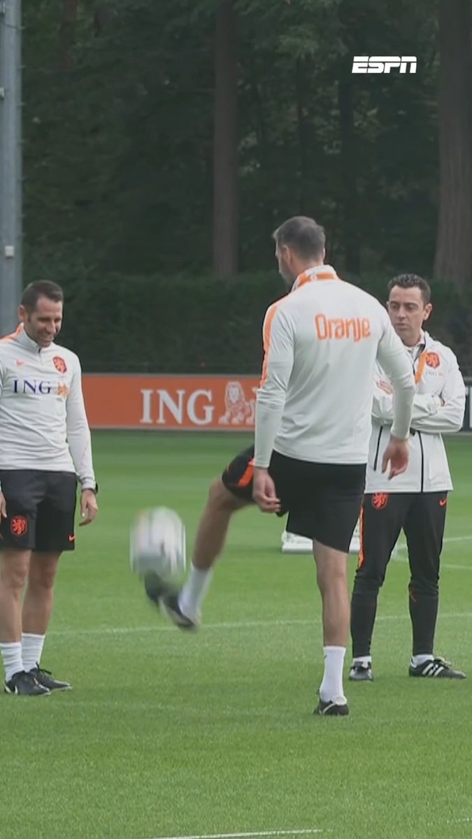ESPN screenshot of Netherlands national football team training session, featuring a player in an 'Oranje' jersey juggling a soccer ball while teammates in ING-sponsored gear observe.