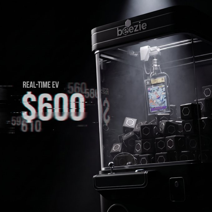 A promotional image for 'beezie' showing a claw machine filled with black boxes and a phone displaying a game, with text 'REAL-TIME EV $600' overlaid on the left side.