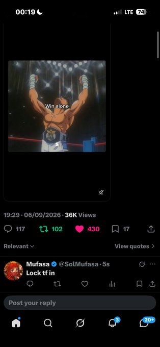 A smartphone screenshot shows a social media post featuring a muscular wrestler raising his arms with text 'Win alone' on screen, posted by Mufasa (@SolMufasa) with the comment 'Lock tf in' on 06/09/2026.