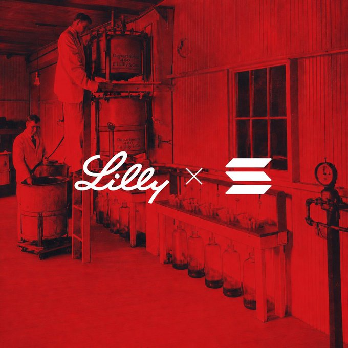 A red-tinted vintage photograph showing two men working with industrial equipment, overlaid with 'Lilly' and a stack logo.
