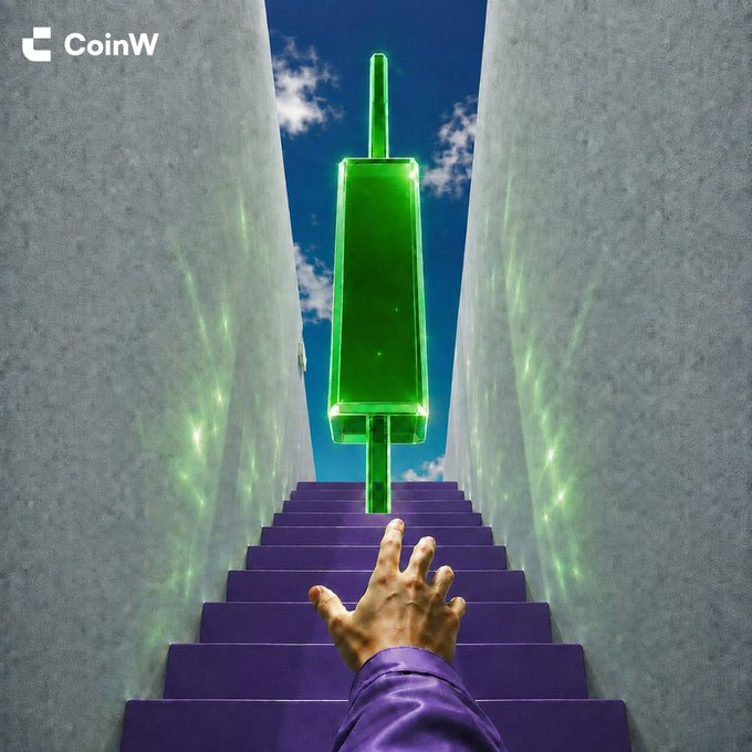 A hand reaches upward along purple stairs toward a glowing green candlestick at the top, framed by concrete walls opening to a blue sky—visually echoing the post's message of "Just one more step…" with the lingering hope of a final bullish rally. The "CoinW" logo appears in the top left corner.