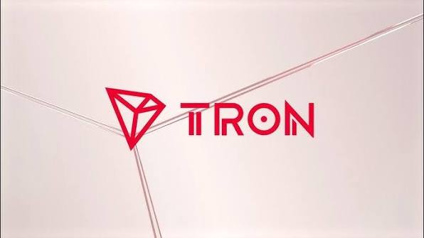 The red 'TRON' logo with its diamond symbol on a white geometric background.
