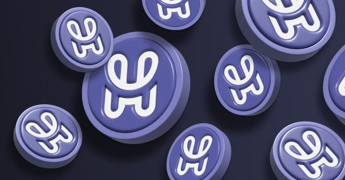 The image shows multiple 3D-rendered purple/blue circular tokens or coins featuring a stylized "H" logo (resembling the HashPack brand) scattered across a dark purple background, visually reinforcing the post's mention of the $PACK token and HashPack's brand identity.