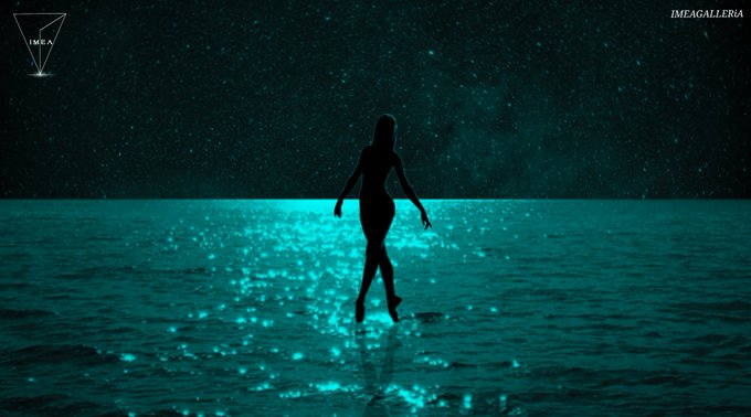 A silhouette of a woman walking across water under a starry night sky, with the water glowing in a bright teal bioluminescence, watermarked with 'IMEA' and 'IMEAGALLERIA'.