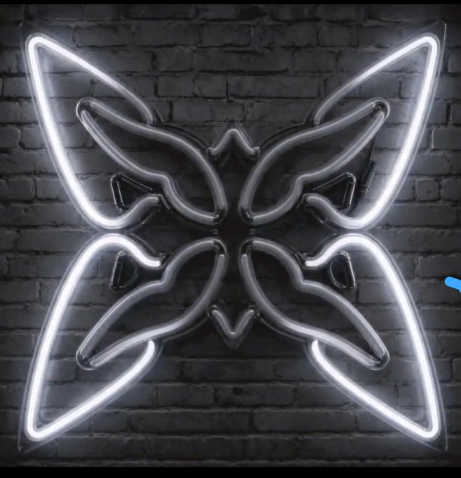A bright white neon sign shaped like the Fnatic esports team emblem (a stylized butterfly or mask) mounted on a dark brick wall.