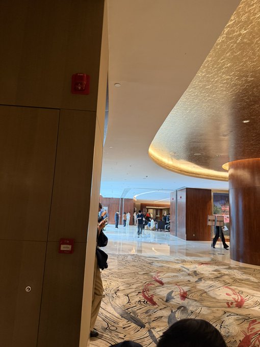 A view of the third-floor lobby of the Solana Accelerate Shanghai event, where attendees are waiting due to a one-hour delay in the event's opening.