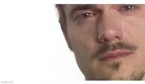 A close-up of a man with a tearful, pleading expression, capturing the desperate sentiment of someone begging an influencer or analyst to "please bro" write or update a thesis on a coin while it dumps in price. The crying face perfectly embodies the emotional frustration of a crypto holder pleading for guidance during a market downturn.
