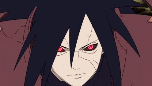 The image features a character with red eyes, possibly from an anime or video game, staring directly at the camera. The character has black hair and is wearing a black outfit that contrasts with their red eyes. They are looking down towards the viewer, giving off an intense and focused expression. In the background, there's a pinkish-red color, which could be related to the character's outfit or the setting of the image.