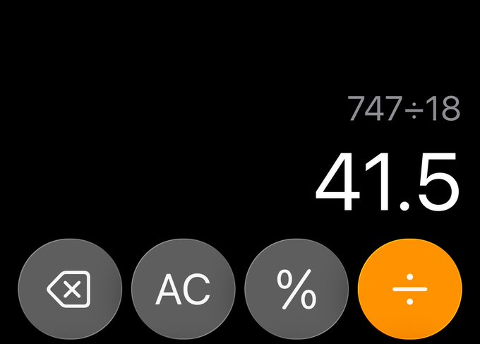 The image is a screenshot of an app icon with various buttons, including a number key for math operations (addition, subtraction, multiplication, division), and other symbols like equal sign, x, and ac. The main focus of this image is on the percentage symbol next to the division button.
