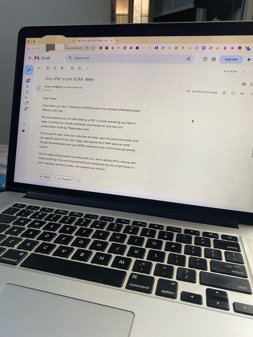 A laptop screen displays a Gmail inbox showing an email titled 'Your offer to join XORA' from Jonas Lundgren to 'me', with body text welcoming the recipient to XORA as part of the Growth & Marketing team and offering a PCF position with a $9,500 welcome credit.