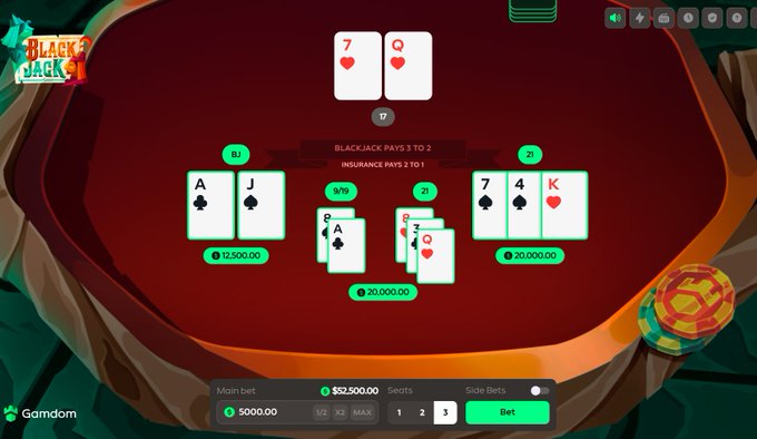 The image shows an online blackjack game interface at Gamdom featuring a winning hand with the dealer's 7 and Queen of hearts and a player's blackjack hand of Ace and Jack of spades. The "Main bet" displays $52,500.00, correlating with the post celebrating a +$52,000 win during the live stream at kick.com/yungreal.