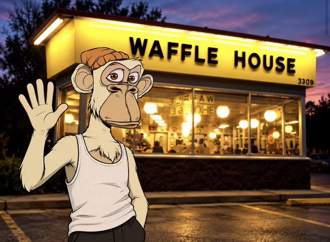 A cartoon monkey character wearing a white tank top and an orange beanie waves at the camera, standing in front of an illuminated 'WAFFLE HOUSE' restaurant at dusk.