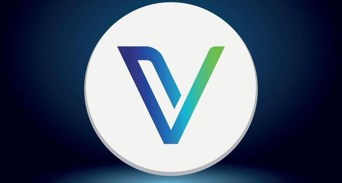 A 3D rendered coin or button featuring a stylized 'V' logo in a gradient of blue and green colors against a dark blue background.