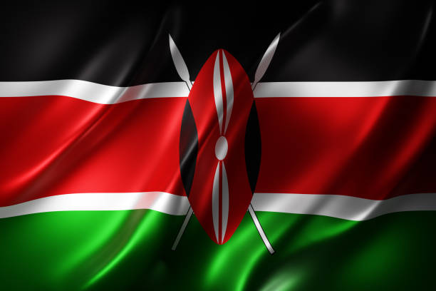 The image shows the flag of Kenya waving, featuring its distinctive black, red, white, and green horizontal stripes with the central Maasai shield and crossed spears emblem. This national symbol directly represents Kenya, the country highlighted in the post about the National Examinations Council placing over 30 million academic credentials on the Avalanche blockchain network for verifiable record keeping.
