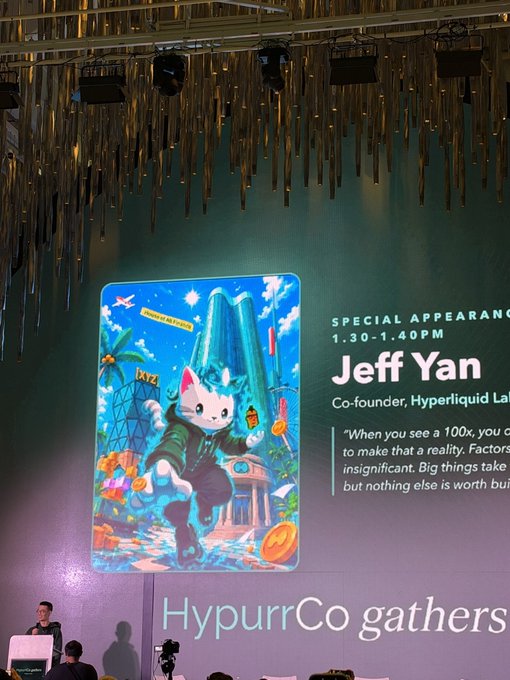 A stage banner for a "HypurrCo gathers" event at NFT NYC promotes a special appearance by Jeff Yan, co-founder of Hyperliquid Labs, from 1:30-1:40 PM, featuring a colorful illustration of a cartoon cat holding corn and a drink alongside the quote "When you see a 100x, you [go] to make that a reality. Factors [are] insignificant. Big things take [time] but nothing else is worth buil[ding]." The whimsical, community-focused branding with playful artwork and founder accessibility visually reinforces the post's sentiment of Hyperliquid as a refreshing counter to typical crypto cynicism.