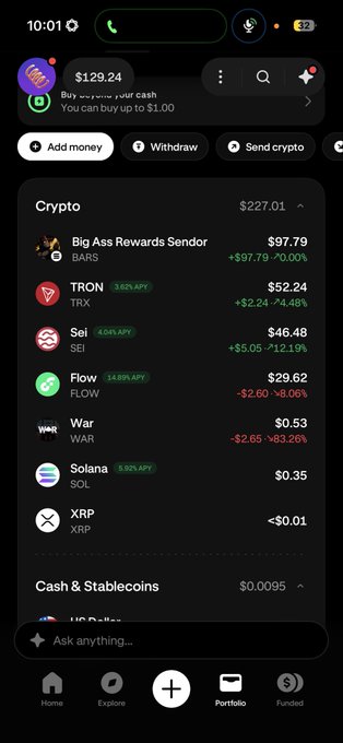 A cryptocurrency portfolio screenshot on a mobile app showing a total value of $129.24, with holdings including Bigg Ass Rewards Sender ($97.79), TRON ($52.24), Sei ($46.48), Flow ($29.62), War ($0.53), Solana ($0.35), and XRP (<$0.01), along with an 'Ask anything...' AI prompt bar.