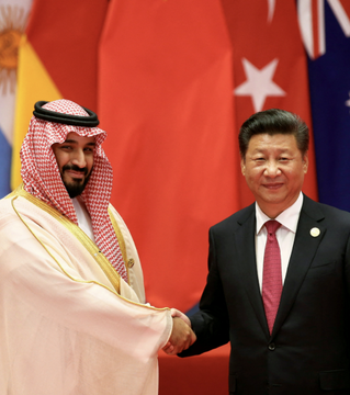 Saudi Crown Prince Mohammed bin Salman shakes hands with Chinese President Xi Jinping, amidst news of Saudi Arabia withdrawing from the China-led mBridge digital currency platform.