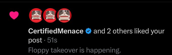 A social media notification showing a pink heart and three floppy disk emojis, reading 'CertifiedMenace ✓ and 2 others liked your post · 51s' with the caption 'Floppy takeover is happening.'