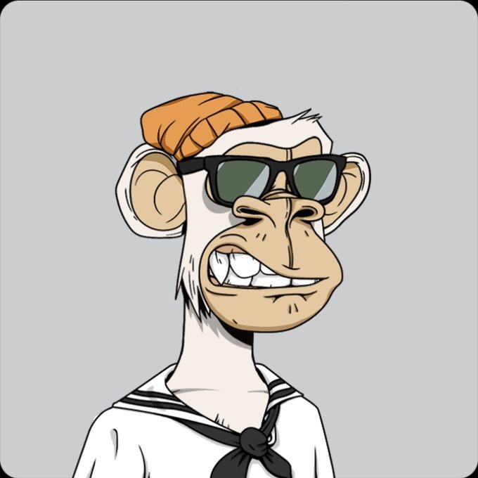 A cartoon illustration of a monkey wearing an orange beanie, green sunglasses, and a white sailor shirt with a black neckerchief, grinning widely to show its teeth.