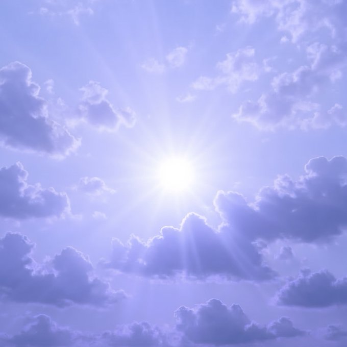 A serene photograph of a bright sun shining through scattered clouds in a purple-tinted sky, with visible sun rays radiating outward.