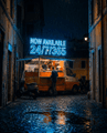 A dimly lit cobblestone alleyway at night with a neon sign reading 'CINEMA 24/7/365' glowing blue above a storefront.