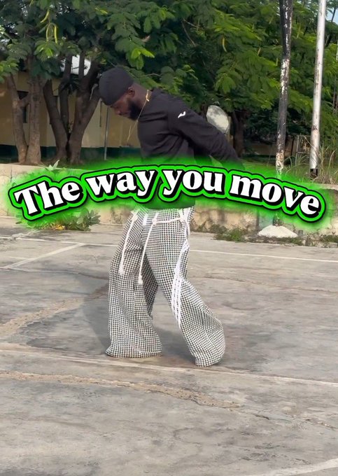 A person in a black top and checkered pants dancing outdoors, with green stylized text overlay reading 'The way you move'.