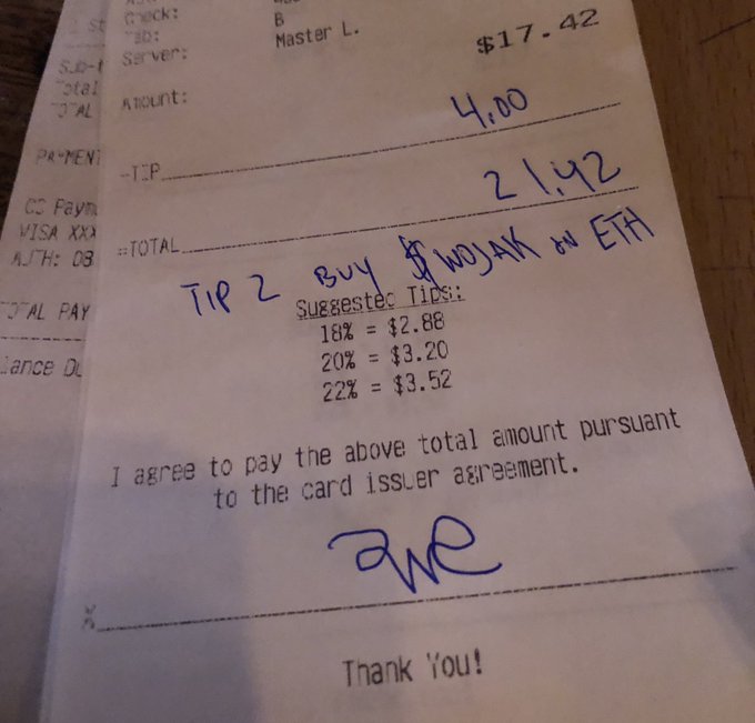 The image shows a receipt for a meal, with the total cost of the meal written in blue ink. The receipt also includes a note from the customer, stating that they are happy to accept the card payment.