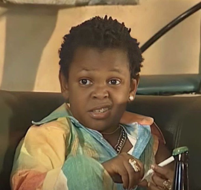 A young child with a sassy expression sits in a chair wearing colorful clothing and jewelry, holding what appears to be a cigar. The image humorously represents the poster's feelings of exhaustion or unimpressed reaction after farming multiple crypto airdrops like Grass and Somnia, suggesting they feel like a seasoned veteran who's "been there, done that."