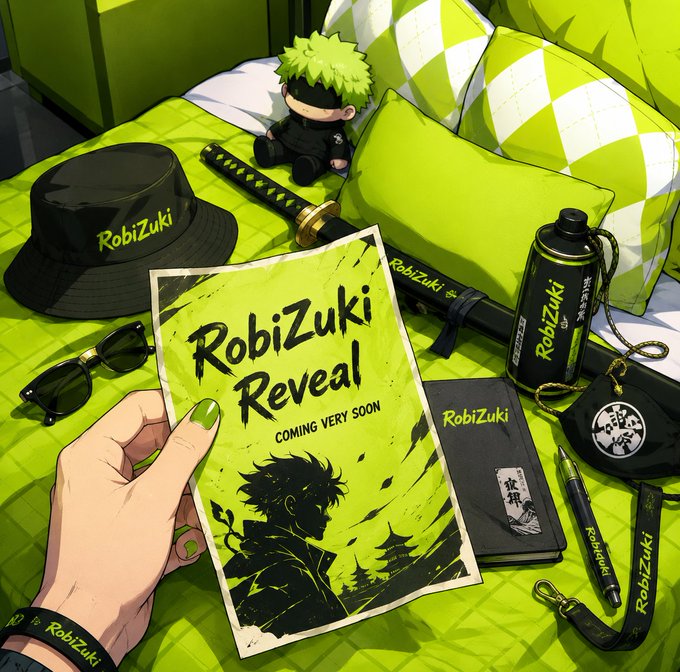A hand holds a vibrant neon green "RobiZuki Reveal - COMING VERY SOON" poster surrounded by branded merchandise including a black bucket hat, sunglasses, a katana, plush toy, water bottle, notebook, and pen, all featuring the "RobiZuki" name. The promotional imagery ties directly to the RobiZukiList NFT collection mint announcement on OpenSea, showcasing the project's branding and theme ahead of the reveal.