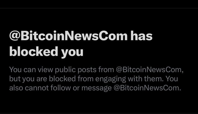 Twitter notification stating '@BitcoinNewsCom has blocked you', preventing engagement with their posts.
