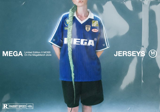 The image features a woman wearing an oversized, blue soccer jersey with white lettering that says "MEGA" along with green hair bands. The background has a blurred, cloudy appearance, which makes the colorful sports outfit stand out even more. The post she is associated with appears to be promoting a merchandise sale for the MEGA brand and it provides details about how users can make purchases or trade their items using the mentioned social media platforms.