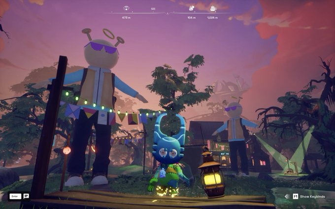A video game screenshot showing a character with blue hair at sunset in a colorful environment with large mascot figures wearing sunglasses.