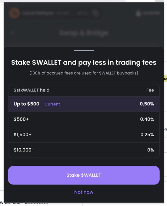 A mobile app screen displaying a fee structure titled 'Stake $WALLET and pay less in trading fees', showing tiered discounts from 0.50% down to 0% based on holdings, with a 'Stake $WALLET' button.