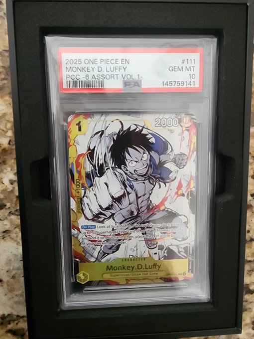 A graded PSA 10 GEM MT 2025 One Piece trading card featuring Monkey D. Luffy, serial number 145759141.
