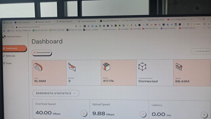 A computer monitor displays the Perceptron Network dashboard showing Points (16.36M), #Nodes (3), #Tunnels (411.17K), Connection Status (Connected), and Uptime (88.44M), with bandwidth statistics showing 40.00 Mbps download, 9.88 Mbps upload, and 0.00 ms latency.