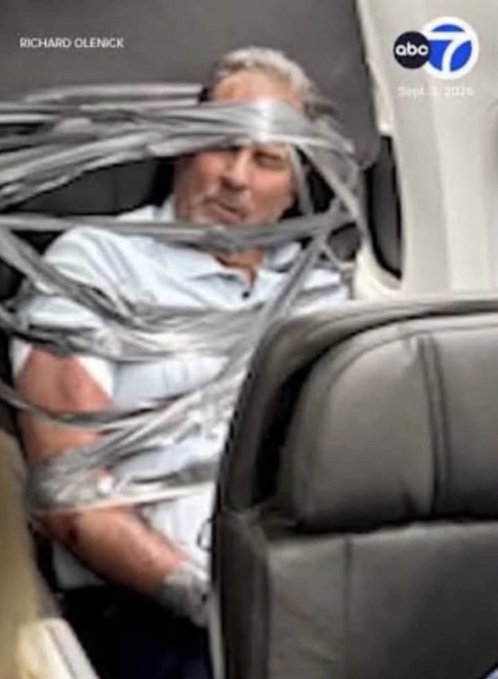 A man is shown duct-taped inside an airplane seat, with the image credited to "RICHARD OLENICK" and dated "Sept. 1, 2025" by ABC7—visually suggesting he is "locked in" or unable to sell his crypto holdings during the bull market, just as the post's caption explains.