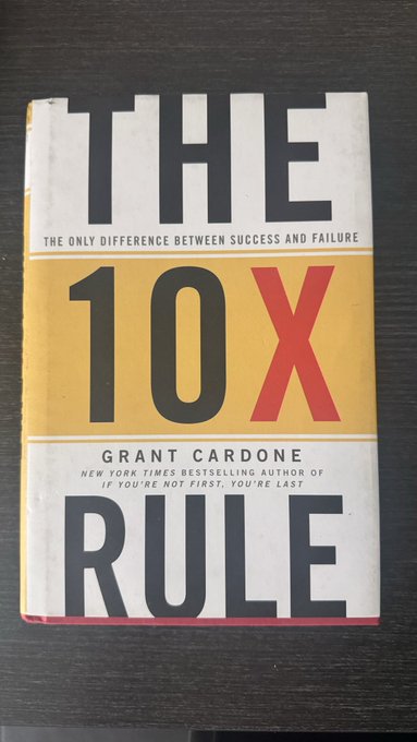 A hardcover copy of the book 'The 10X Rule' by Grant Cardone, with the subtitle 'The Only Difference Between Success and Failure'.